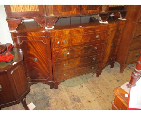Reproduction mahogany sideboard having four central drawers flanked by two panelled doors raised on bracket feet