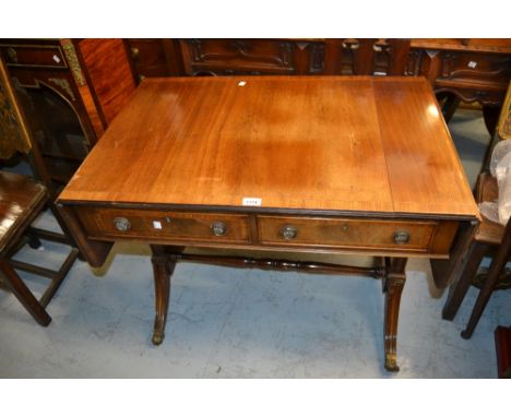 20th Century mahogany drop-leaf sofa table on single end supports with splayed legs and brass caps and casters