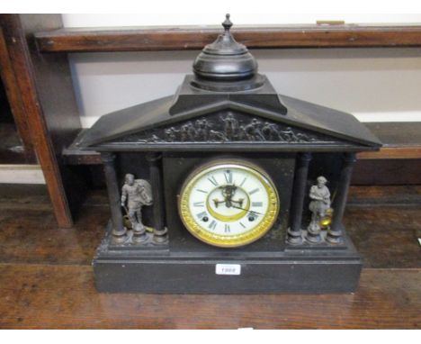 19th Century black slate mantel clock having circular dial with Roman numerals, visible escapement and two train movement str