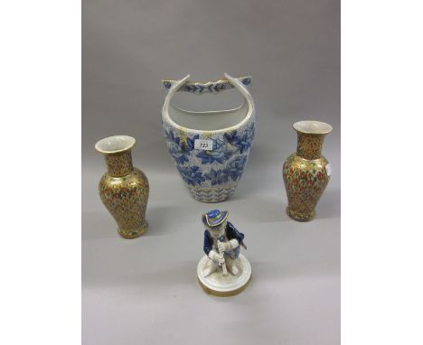 Continental porcelain figure of a boy playing a wind instrument, pair of enamel and gilt decorated baluster form vases and a 