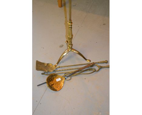 Brass standard lamp with tripod base together with a quantity of brass fire tools