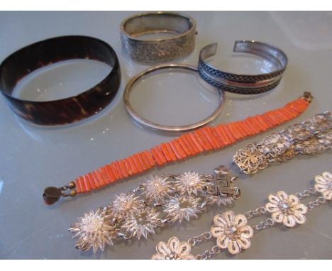 19th Century coral bracelet, three silver bangles, simulated tortoiseshell bangle and three filigree bracelets