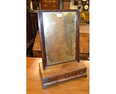 George III mahogany rectangular swing frame box toilet mirror with three drawer ogee fronted base and bracket feet