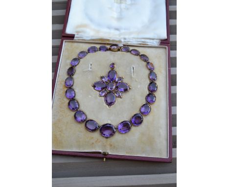 Fine 19th Century amethyst Riviere necklace with pendant cross by Garrard & Company, composed of twenty two graduated oval sh