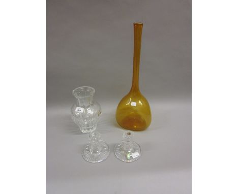 Pair of Waterford crystal dwarf candlesticks, a Waterford glass vase and an amber glass narrow neck vase