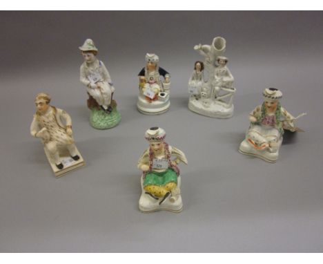 Pair of 19th Century Staffordshire figures of seated Turks, similar inkwell and three other small Staffordshire figures