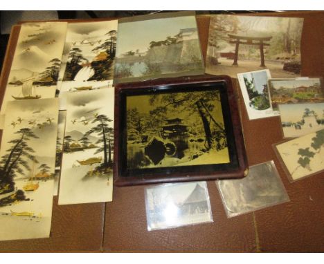 Quantity of Japanese photographs and postcards, together with a Japanese lacquer framed reverse photographic print on glass