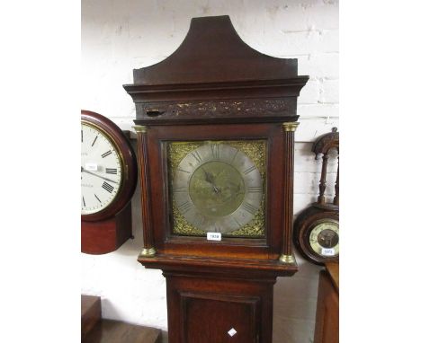 George III longcase clock, the square hood above a rectangular door and conforming plinth base, the brass dial with silvered 