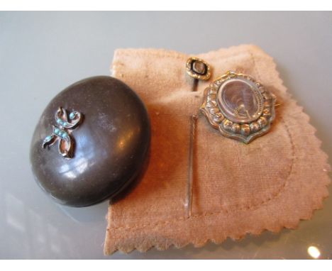 Antique Whitby jet oval locket, mourning stick pin and a brooch