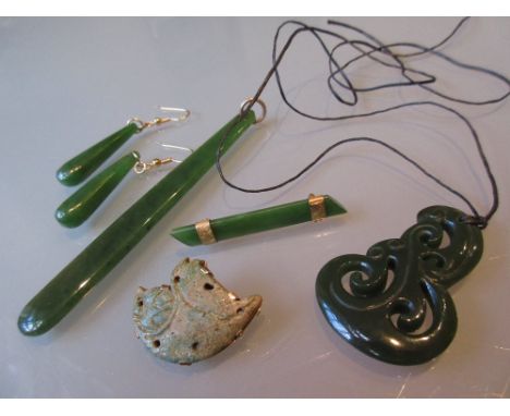 Group of New Zealand jade jewellery including a 9ct gold mounted brooch, another brooch, two pendants and a pair of drop earr