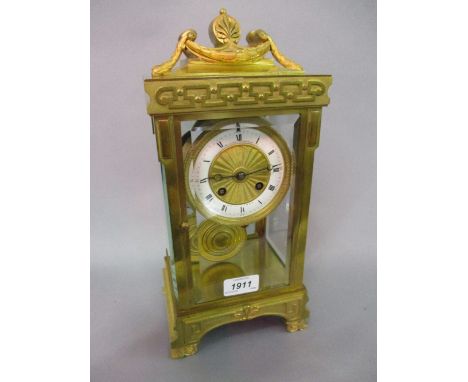 19th Century French gilt brass four glass two train mantel clock striking on a gong, the white chapter ring enclosing an engi