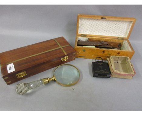 Brass and glass magnifying glass in a wooden case together with a World War II compass and a quantity of drawing instruments