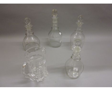 Four 19th Century clear cut glass decanters with stoppers, together with a cut glass jug CONDITION REPORT Jug is 6.5insTalles