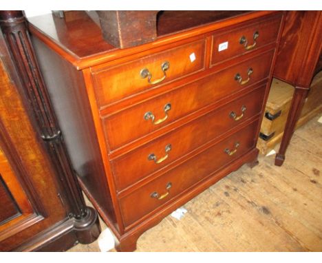 Reproduction mahogany line inlaid chest of two short over three long graduated drawers with brass swan neck handles, raised o