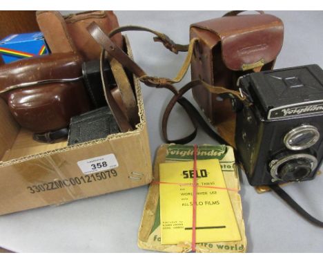 Voigtlander camera together with a quantity of other cameras