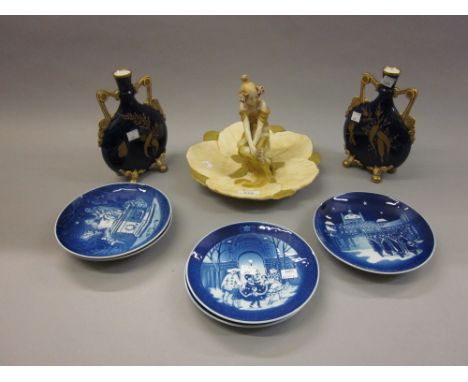 Royal Vienna table centre mounted with a seated figure of a young girl, together with five Royal Copenhagen Christmas plates 