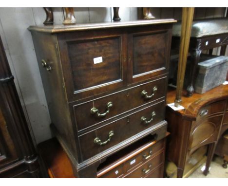 George III mahogany commode with two doors above two dummy drawers on bracket feet