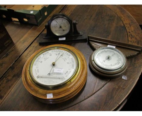19th Century circular oak cased aneroid barometer together with a Short and Mason Bakelite cased barometer and an oak cased b