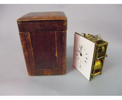 Brass carriage clock movement with enamel dial and alarm function together with a leather travel case CONDITION REPORT No ser