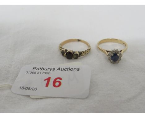 A DRESS RING SET WITH A SMALL SAPPHIRE (ABOUT 4.5MM X 3MM) SURROUNDED BY TWELVE VERY SMALL DIAMONDS, STAMPED 9CT, GROSS WEIGH