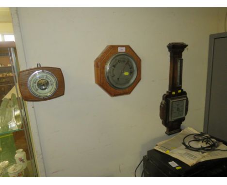 OAK MOUNTED BAROMETER THERMOMETER AND TWO OTHER OAK MOUNTED BAROMETERS
