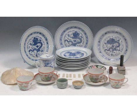 A collection of Chinese including a set of plates decorated with dragons, mother of pearl counters and teacups and saucersThe