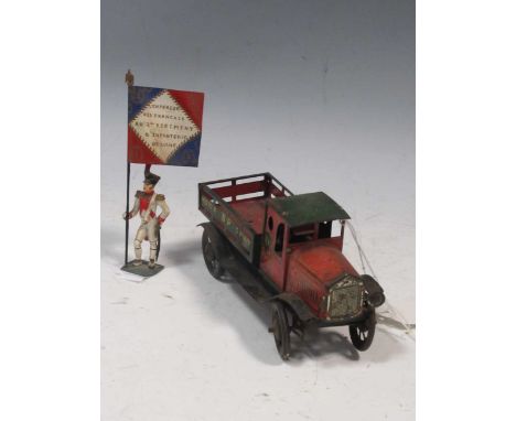 A Wells of London vintage tin plate toy lorry, ‘B.P. Motor Sport’, lacks one headlamp, 9 x 6 x 17cm; together with a French f