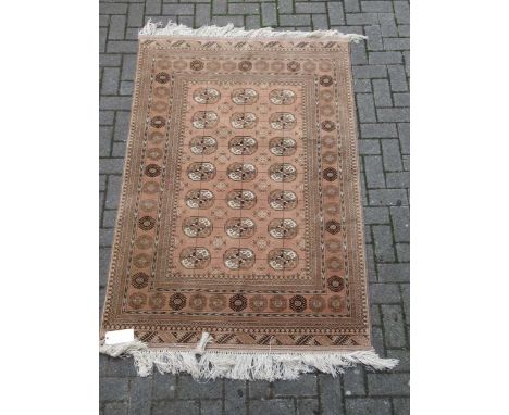 zzz A modern Tekke rug with orange ground, together with another rug (2) A modern Tekke rug with orange ground 208 x 121cm to