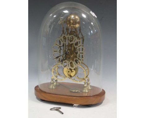 A Victorian gilt brass skeleton clock, striking on one bell, with pierced silvered dial with black enamel Roman numerals, und