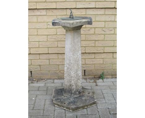 A sundial on a composite base, 89cm high