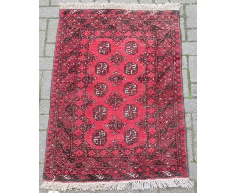 zzz A Tekke rug, together with a Tekke type rug and a purple ground rug (3) A Tekke rug 141 x 78cm together with a Tekke type