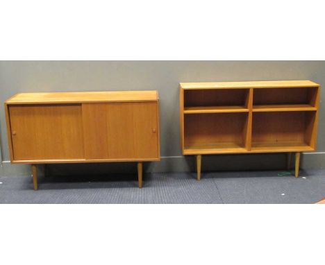 zzz A 20th century teak sideboard on tapered legs together with a teak open bookshelf on tapered legs A 20th century teak sid