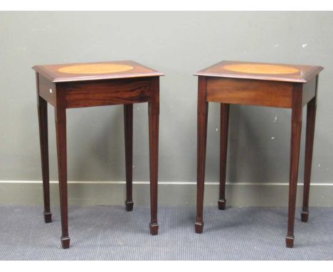 In the manner of Titchmarsh and Goodwin a pair of crossbanded mahogany lamp tables with oval inlaid top on reeded tapering sp