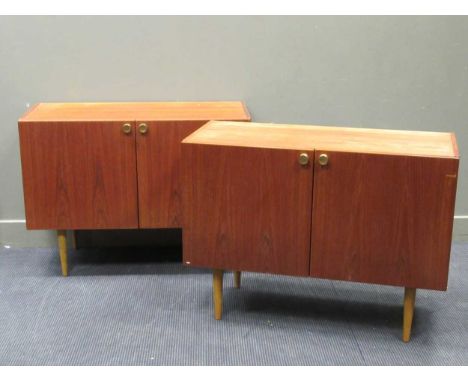 zzz A pair of Danish late 20th century two door side cabinets with metal handles and tapered legs (2) A pair of Danish late 2
