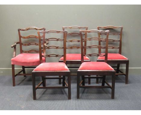 A set of four George III mahogany pierced ladderback dining chairs together with a later ladder back carver (5)