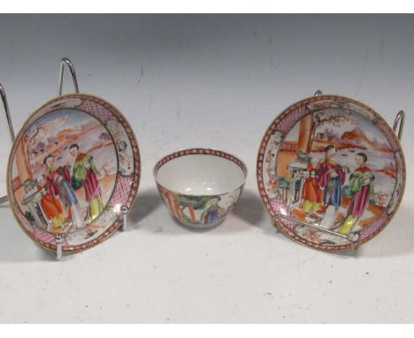 A Chinese Mandarin tea bowl and two matching saucers, Qianlong, late 18th century,  decorated with interior scenes of two wom