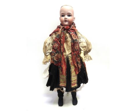 AN ARMAND MARSEILLE BISQUE SOCKET HEAD DOLL  lacking wig, with sleeping grey glass eyes and an open mouth with four upper tee