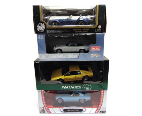 FOUR 1/18 SCALE DIECAST MODEL CARS  comprising an Auto Art No.75301, 1979 Lotus Esprit, yellow; Sunstar No.4054, 1966 Lotus E