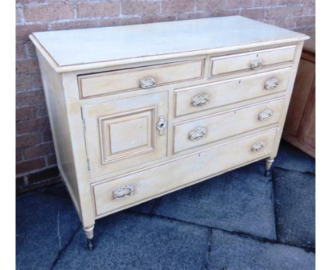AN EDWARDIAN PAINTED SIDEBOARD  fitted with an arrangement of five drawers (one a replacement) and a cupboard, on turned supp
