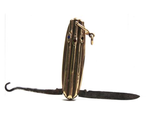 A COMBINATION PENKNIFE  with a button hook and three propelling pencils for red, blue and black built onto the top of the bod