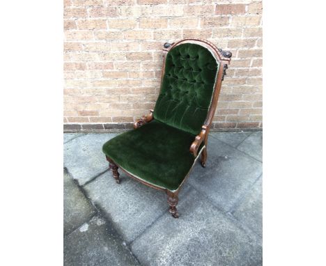 A VICTORIAN BUTTON UPHOLSTERED NURSING CHAIR  with carved oak frame, 62cm wide 68cm deep 94cm high