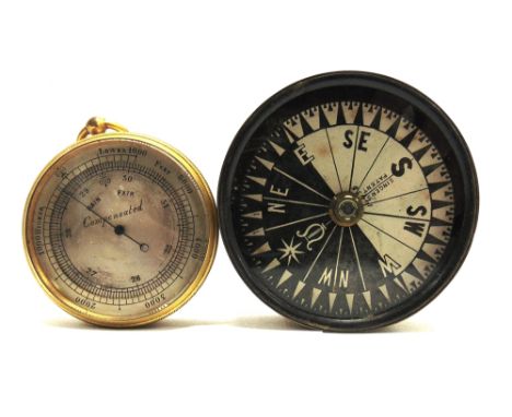 A POCKET BAROMETER  with a circular silvered dial and a gilt metal body, 5.5cm diameter, in a leather travel case; together w