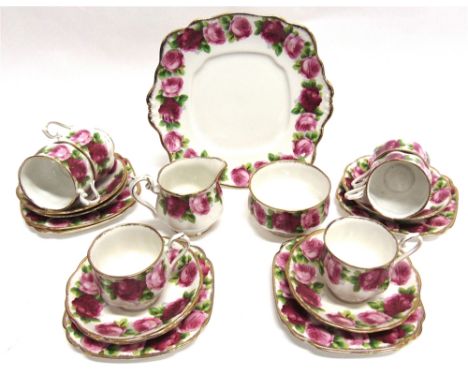A ROYAL ALBERT 'OLD ENGLISH ROSE' PART TEA SERVICE  comprising six teacups, saucers and side plates, milk jug, sugar basin an