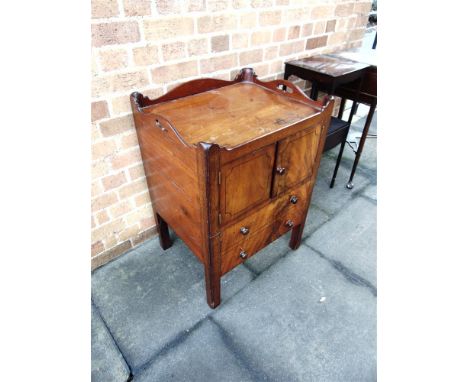 A GEORGE III MAHOGANY TRAY TOP COMMODE  with cupboard above two faux drawers on square moulded supports, 56cm wide 46cm deep 