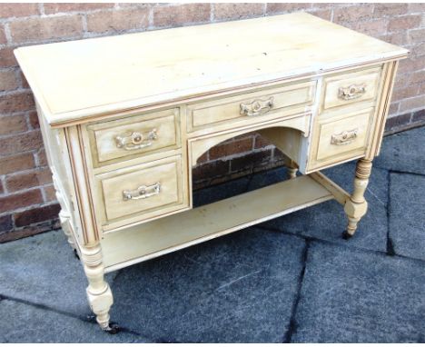 AN EDWARDIAN PAINTED ASH WASHSTAND   on block turned supports with ceramic casters, 106cm wide 52cm deep 77cm high