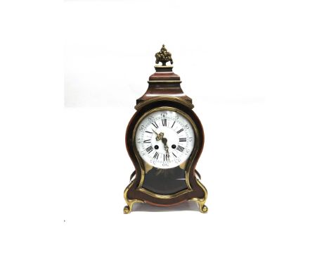 A FRENCH BRASS MOUNTED MAHOGANY CASED MANTLE CLOCK  the 8-day movement striking on a bell, the enamel dial with Roman numeral