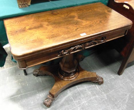 A WILLIAM IV ROSEWOOD CARD TABLE  the frieze with carved decoration, on octagonal inverted baluster support on quatrefoil bas