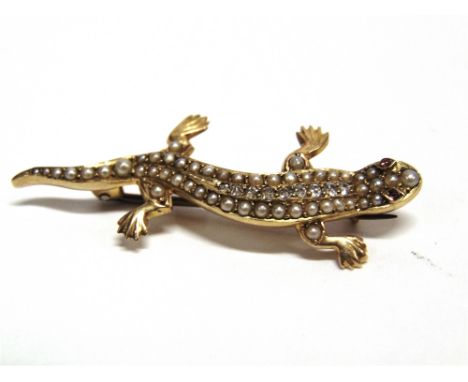 A SEED PEARL DIAMOND AND RUBY LIZARD BROOCH unmarked, pave set with pearls, central line of graduated diamonds and cabochon s