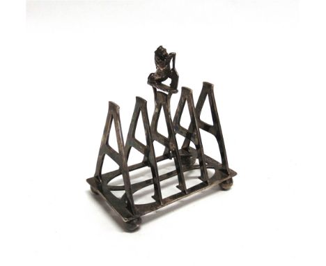 AN UNUSUAL PERSONALISED SILVER TOAST RACK by Fordham & Faulkner, London 1896, each division form by an upper case letter A, w