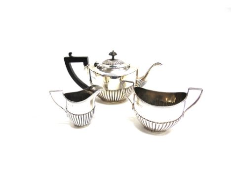 A LATE VICTORIAN THREE PIECE TEA SERVICE  London 1894, of traditional oval gadrooned form, 495g (15.9 troy ozs) gross